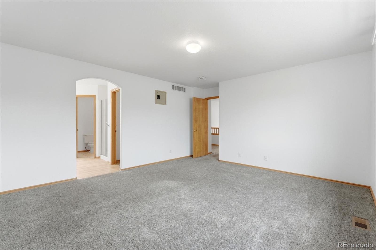 10505 Madison Way Northglenn, CO 80233 - Photo 26 of 49 an empty room with a window and closet
