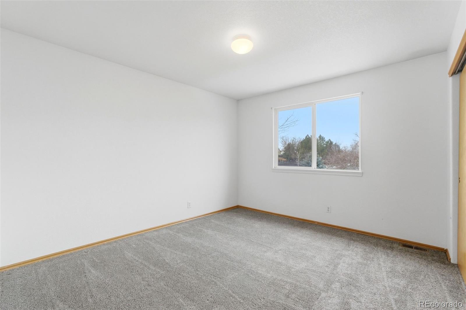 10505 Madison Way Northglenn, CO 80233 - Photo 31 of 49 an empty room with a window