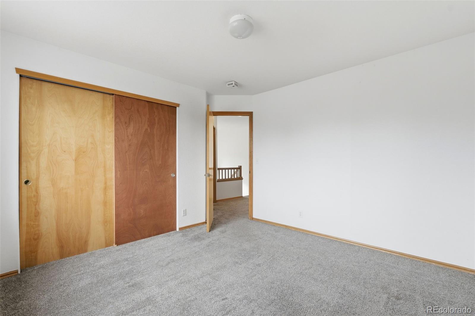 10505 Madison Way Northglenn, CO 80233 - Photo 37 of 49 a view of an empty room and a window