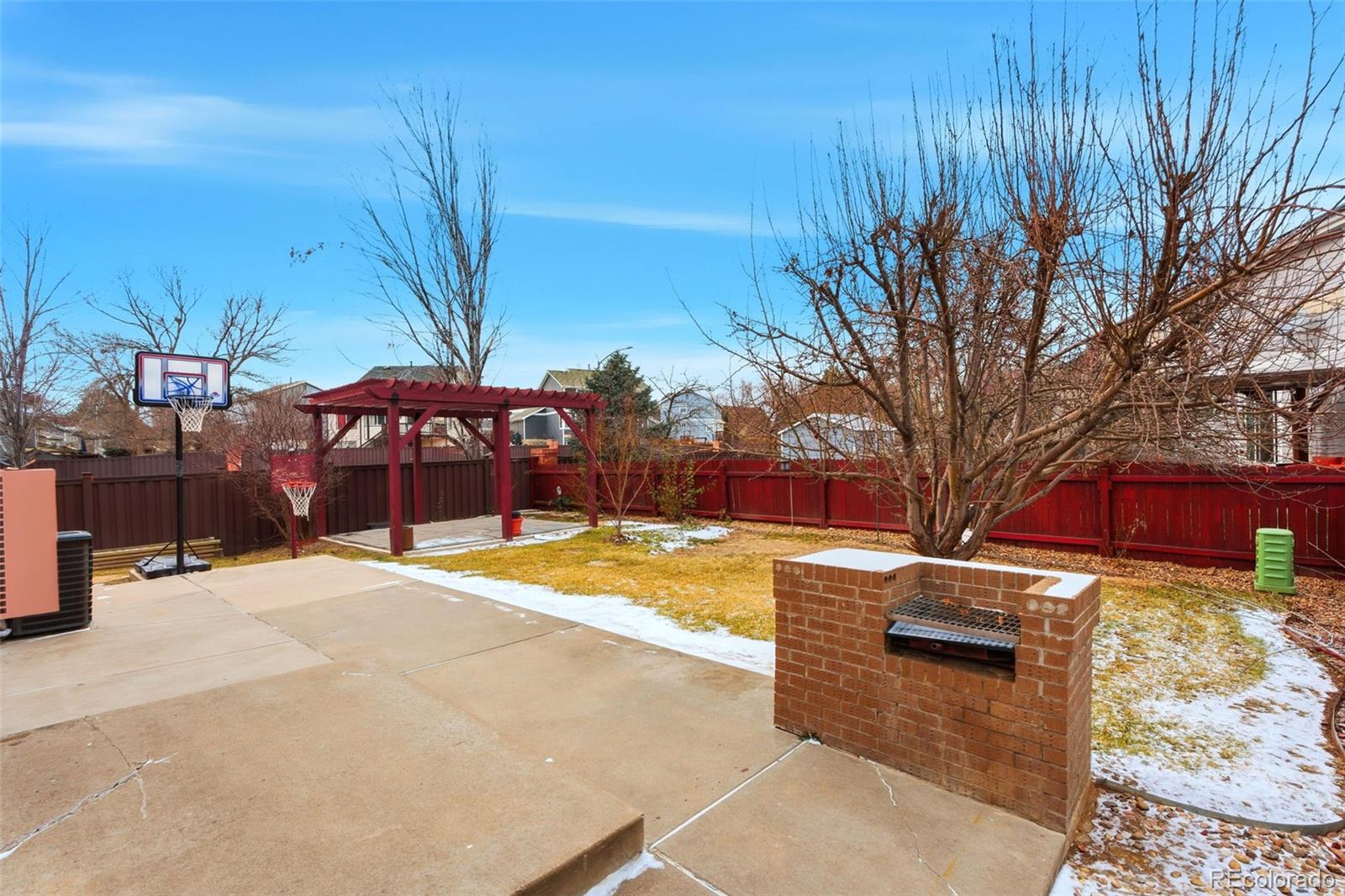 10505 Madison Way Northglenn, CO 80233 - Photo 40 of 49 a view of a backyard with wooden fence