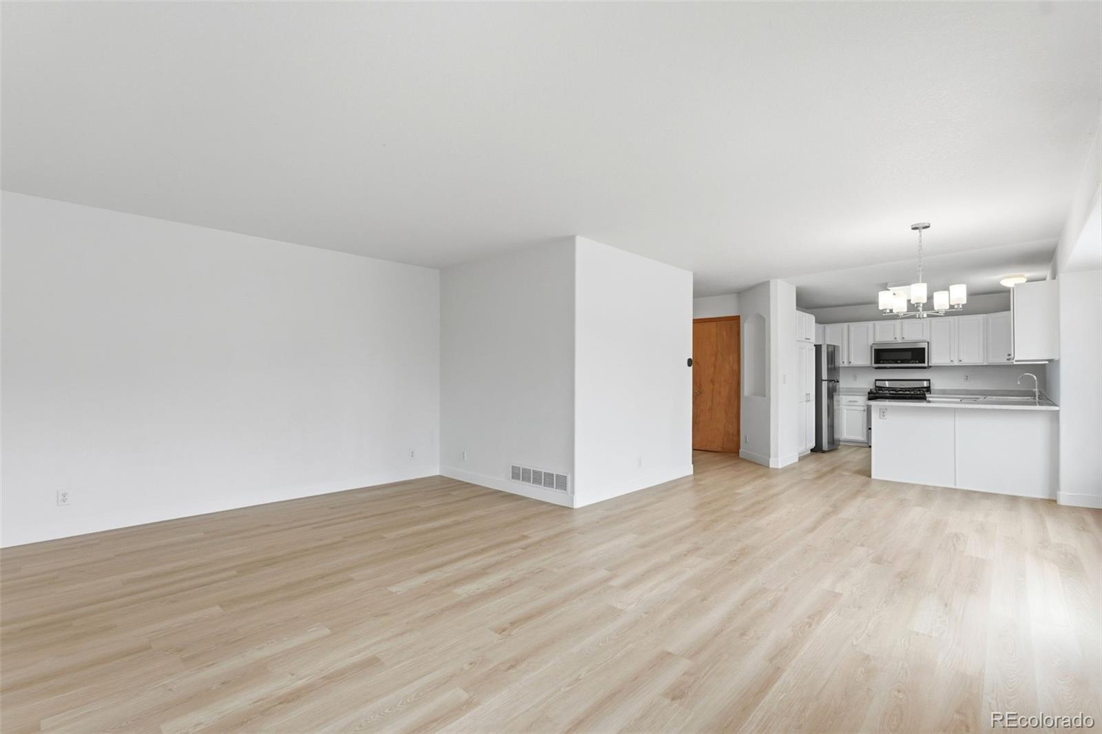 10505 Madison Way Northglenn, CO 80233 - Photo 8 of 49 a view of a kitchen with a sink and a stove top oven