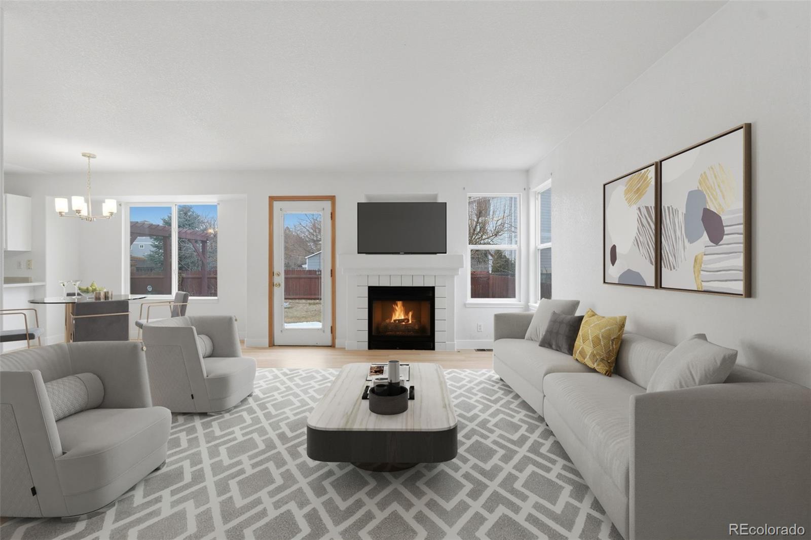 10505 Madison Way Northglenn, CO 80233 - Photo 10 of 49 a living room with furniture and a fireplace