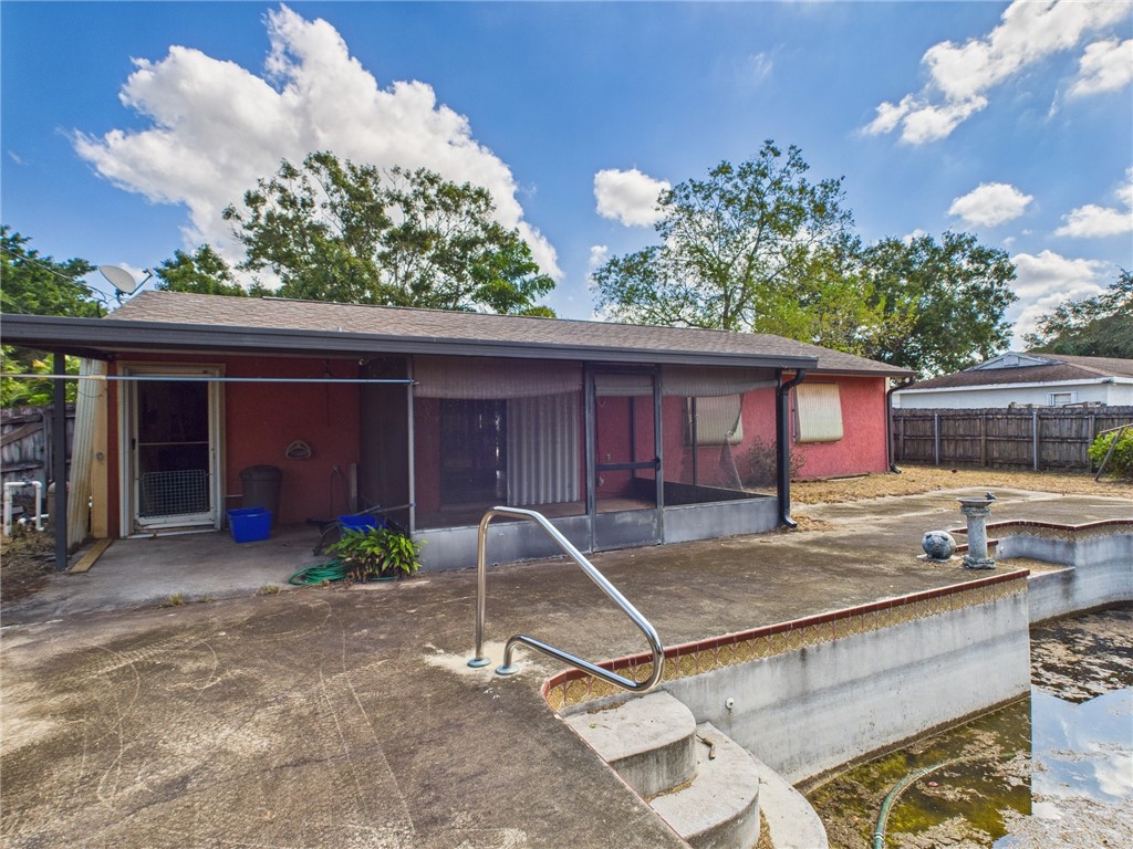 2265 14th Avenue Southwest Vero Beach, FL 32962 - Photo 15 of 20 a view of a house with backyard sitting area and garden
