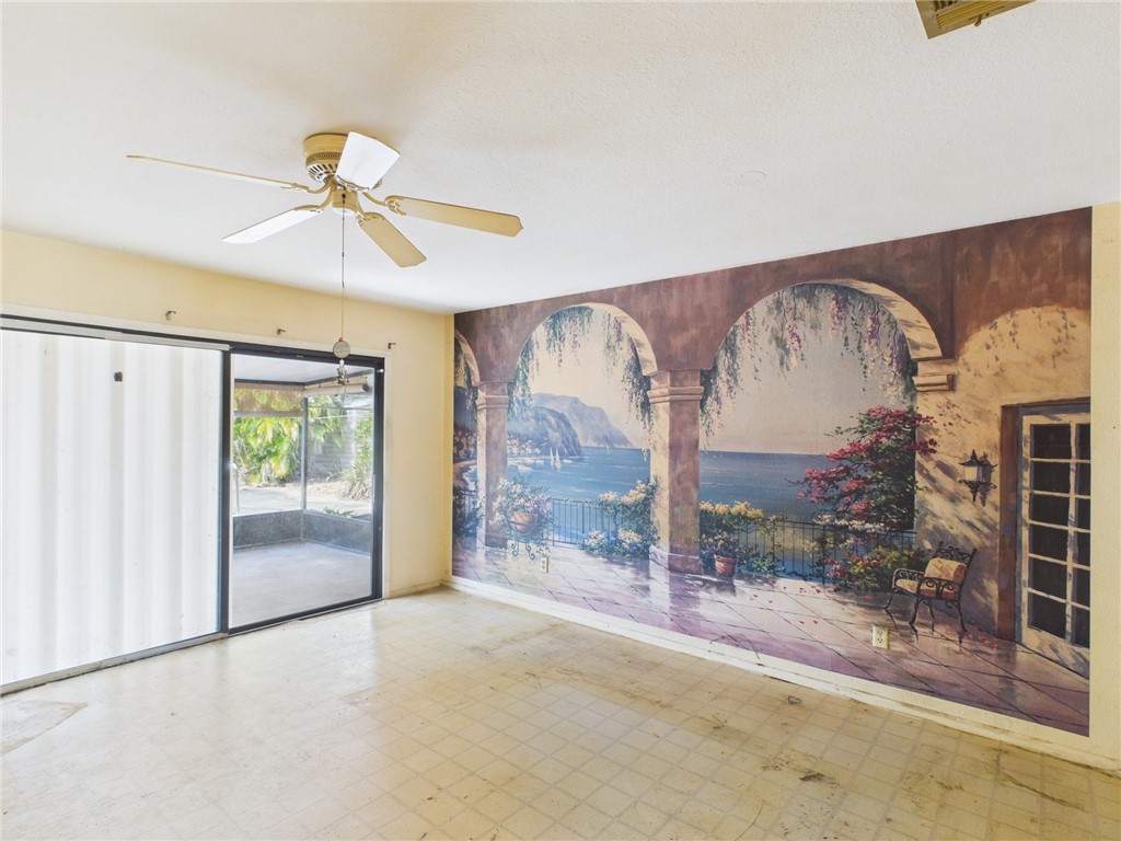 2265 14th Avenue Southwest Vero Beach, FL 32962 - Photo 4 of 20 a view of a big room with wooden floor and windows