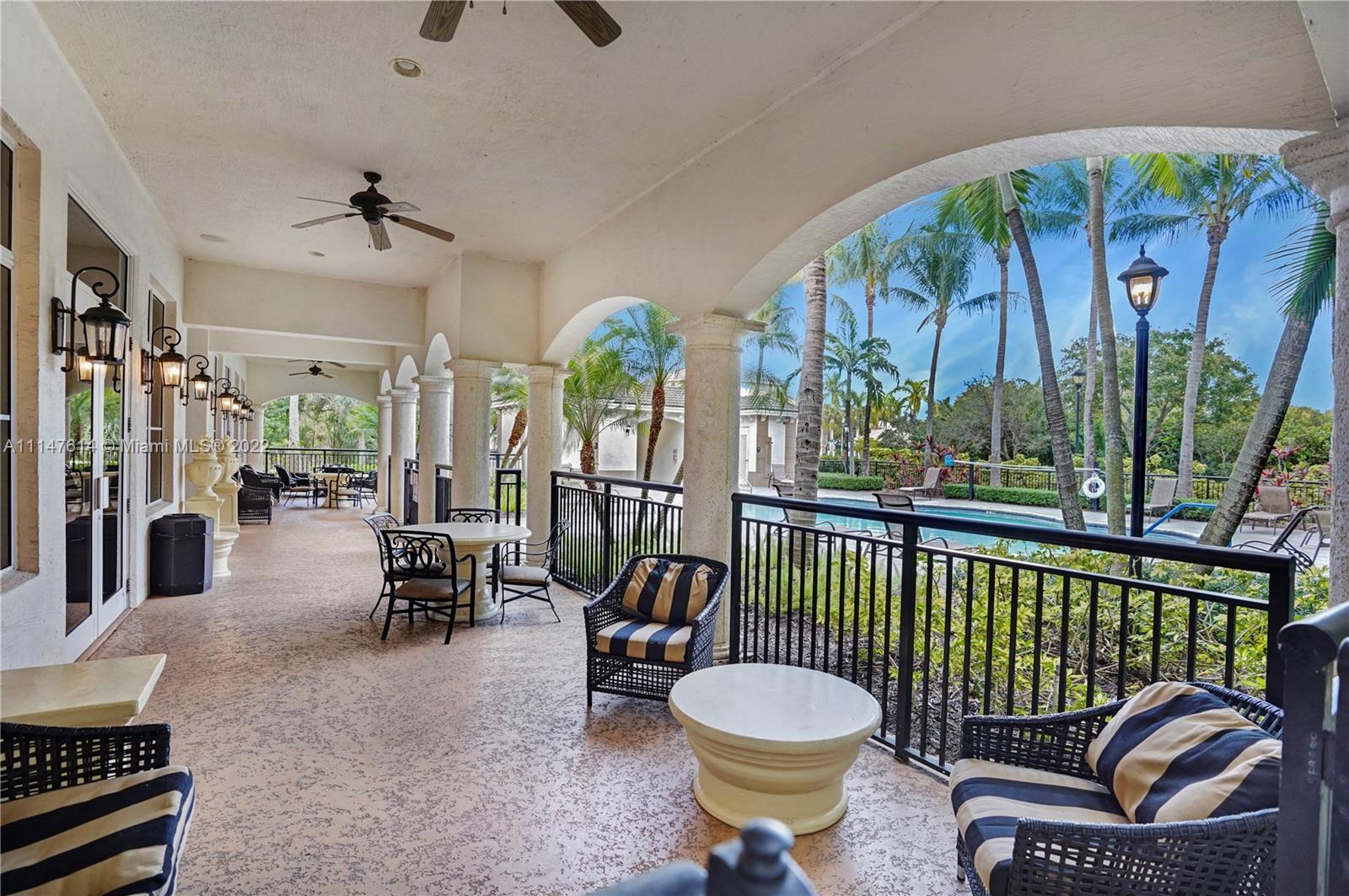 1660 Renaissance Commons Boulevard, Unit 2203 Boynton Beach, FL 33426 - Photo 17 of 20 a outdoor living space with furniture and garden view