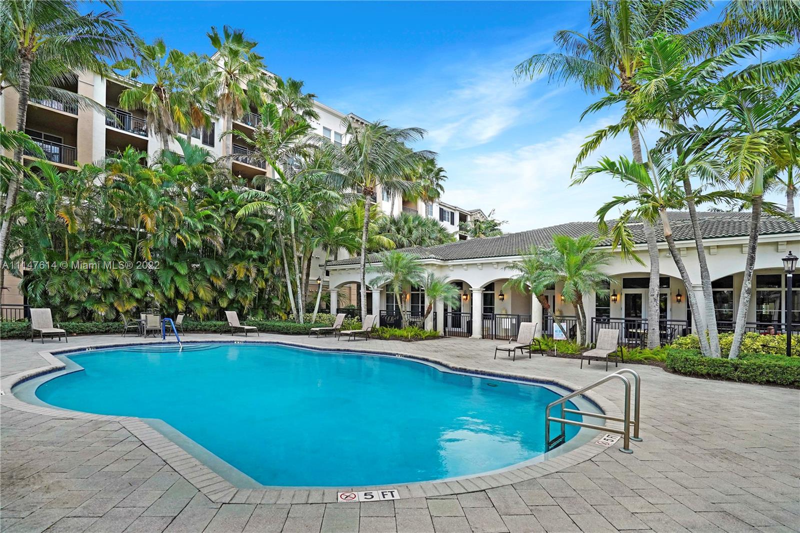 1660 Renaissance Commons Boulevard, Unit 2203 Boynton Beach, FL 33426 - Photo 18 of 20 a view of a building with a swimming pool