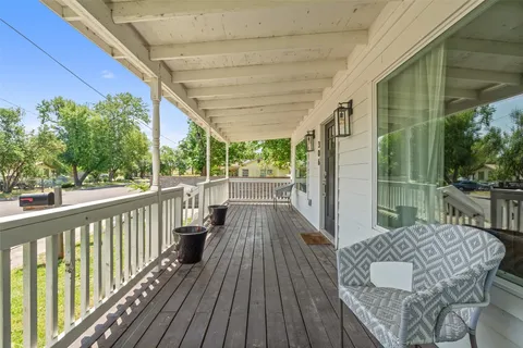 a balcony with wooden floor