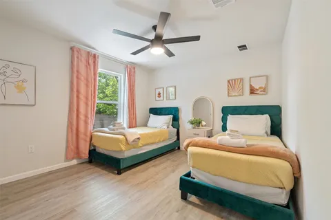 a bedroom with a bed and a couch