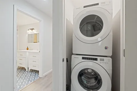 a view of a hallway with washer and dryer