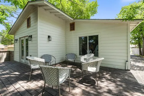a view of a patio with couple of chairs