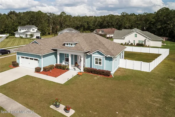 an aerial view of a house with swimming pool