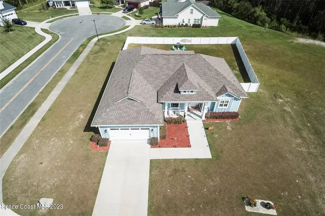 an aerial view of a house with swimming pool