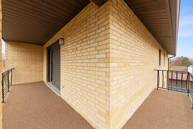 a view of an house with outdoor space and trees all around