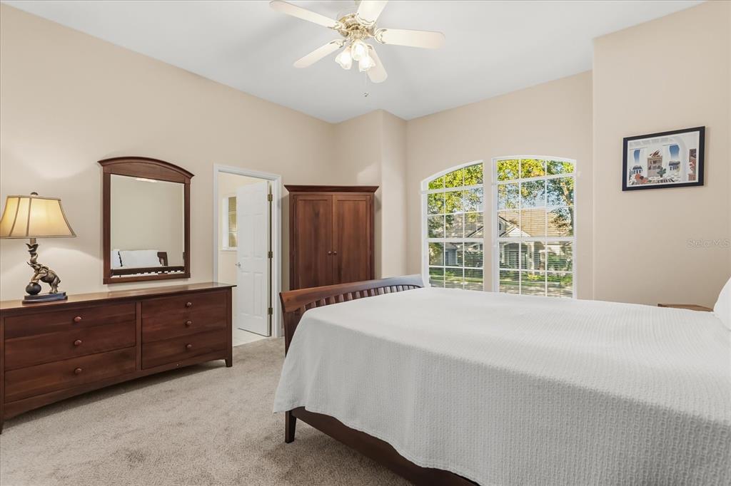 693 Stonefield Loop Lake Mary, FL 32746 - Photo 20 of 40 a spacious bedroom with a bed and a dresser