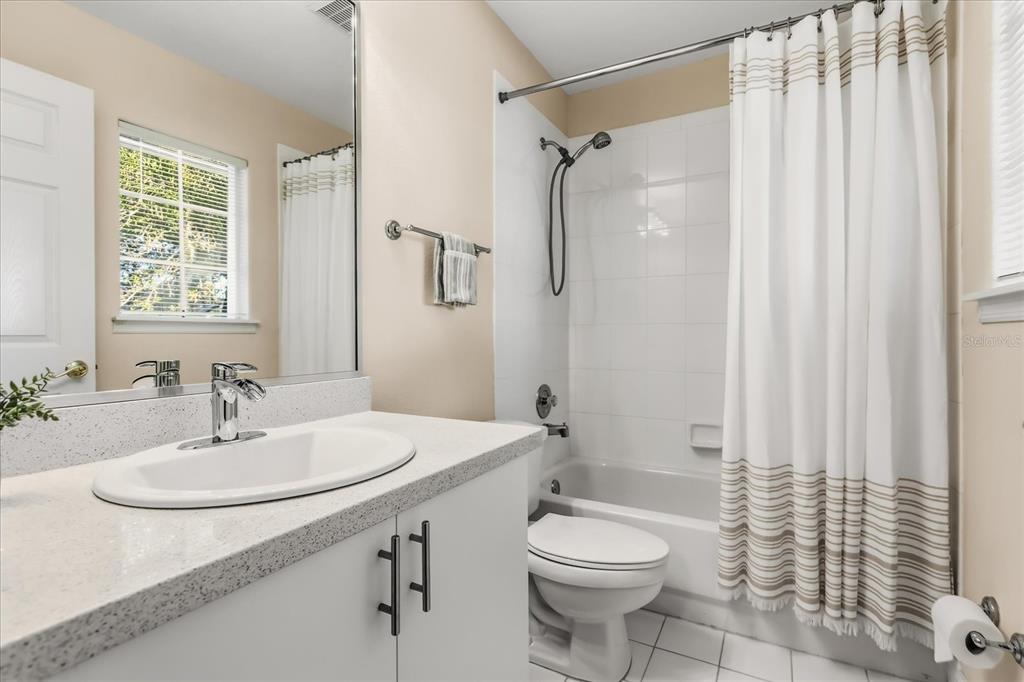 693 Stonefield Loop Lake Mary, FL 32746 - Photo 21 of 40 a bathroom with a sink toilet and shower