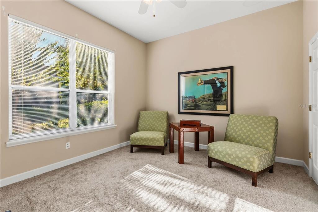 693 Stonefield Loop Lake Mary, FL 32746 - Photo 24 of 40 a living room with furniture and a window