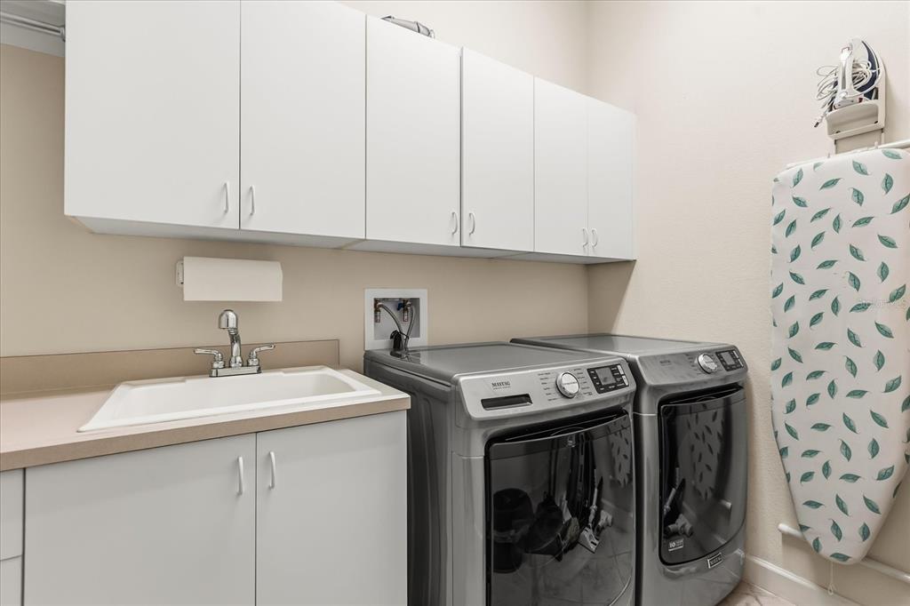 693 Stonefield Loop Lake Mary, FL 32746 - Photo 25 of 40 a utility room with dryer and washer