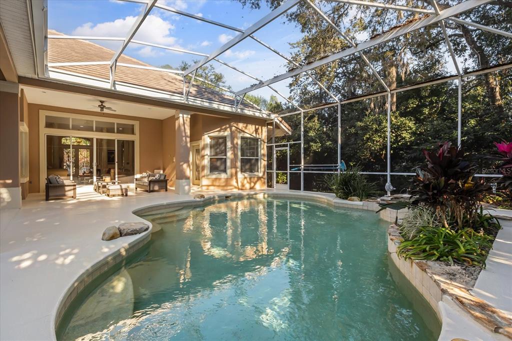 693 Stonefield Loop Lake Mary, FL 32746 - Photo 26 of 40 a view of a swimming pool with a patio