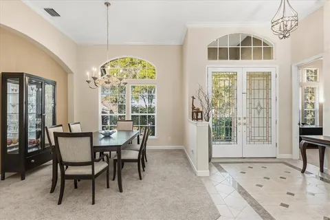 a view of a dining room with furniture window and outside view