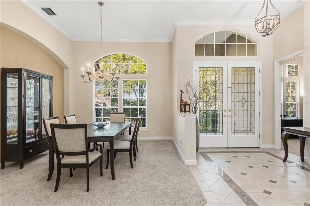 693 Stonefield Loop Lake Mary, FL 32746 - Photo 4 of 40 a view of a dining room with furniture window and outside view