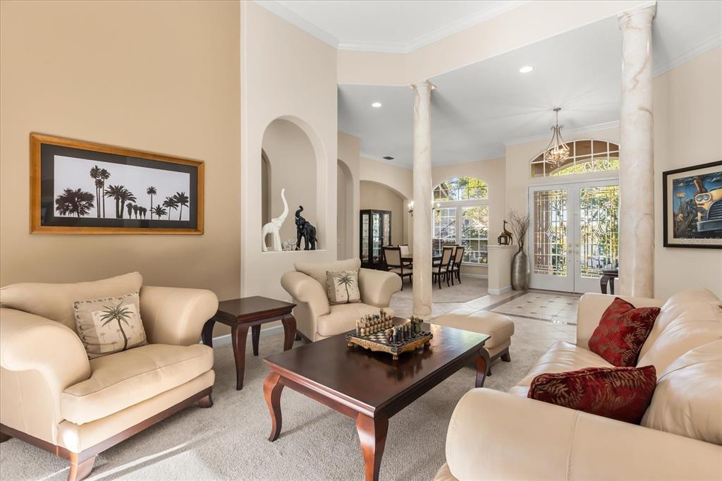 693 Stonefield Loop Lake Mary, FL 32746 - Photo 6 of 40 a living room with furniture and a large window