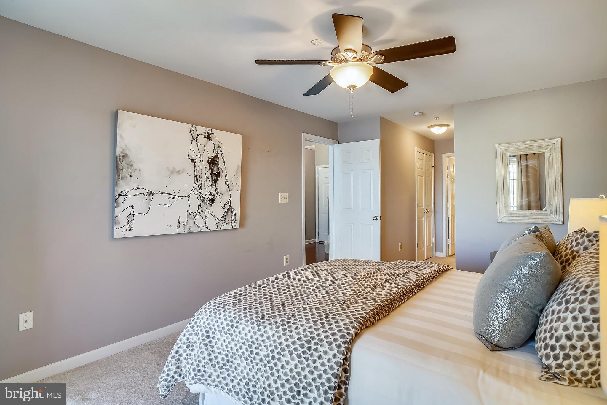415 Ridgepoint Place, Unit 41534 Gaithersburg, MD 20878 - Photo 13 of 44 Lovely primary bedroom suite has en-suite bath