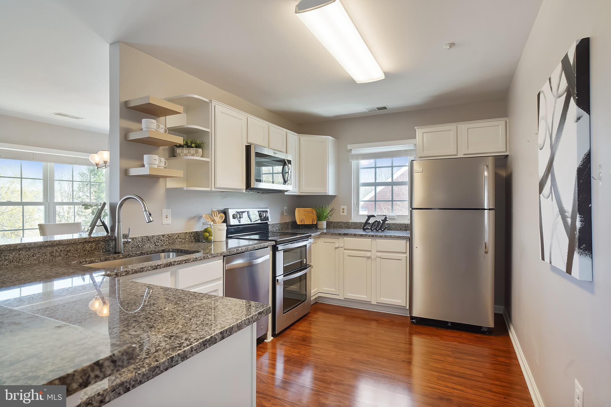415 Ridgepoint Place, Unit 41534 Gaithersburg, MD 20878 - Photo 6 of 44 Kitchen sparkles w/granite & stainless