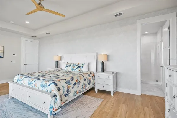 a bathroom with a shower sink and mirror