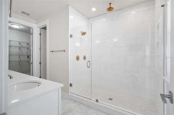 a bathroom with double sink and a mirror