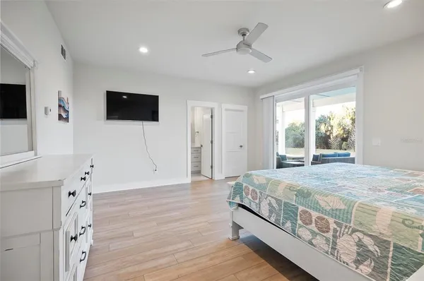a bedroom with a large bed and a view of bedroom