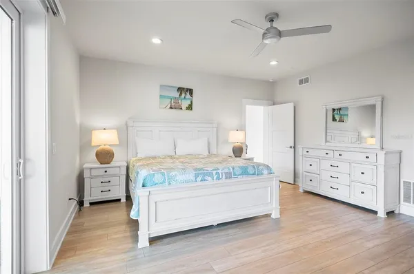a bathroom with a toilet sink double vanity and mirror