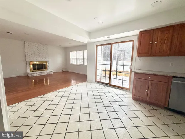 a living room with a large window and a table