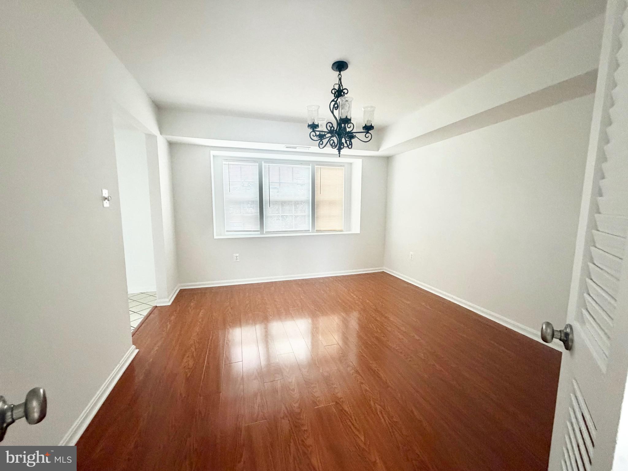 4001 Middle Ridge Drive Fairfax, VA 22033 - Photo 7 of 17 a view of empty room with wooden floor and fan