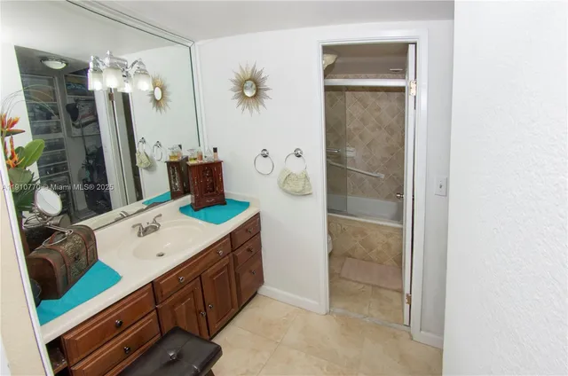 a bed room with a bed and a chair