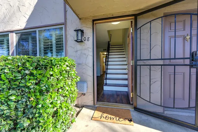 a view of entryway with wooden floor