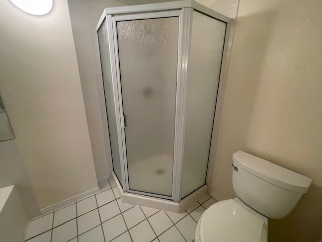 8 Avon Road Northbrook, IL 60062 - Photo 11 of 15 a bathroom with a granite countertop toilet and a shower