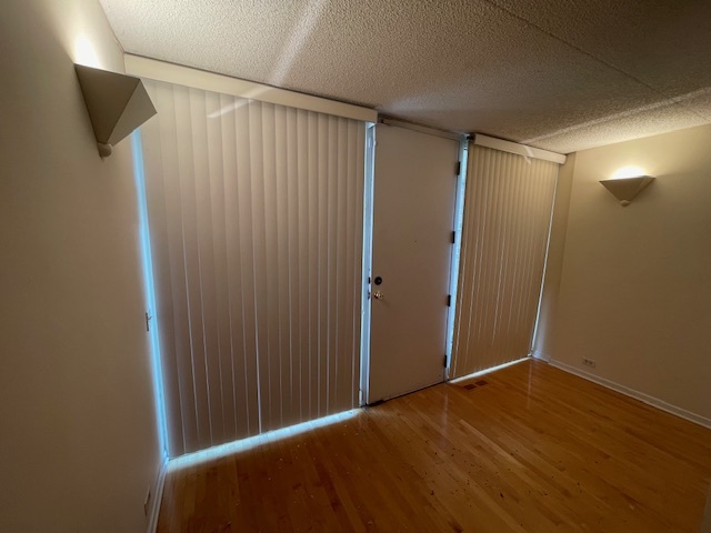 8 Avon Road Northbrook, IL 60062 - Photo 2 of 15 a view of empty room with wooden floor and fan
