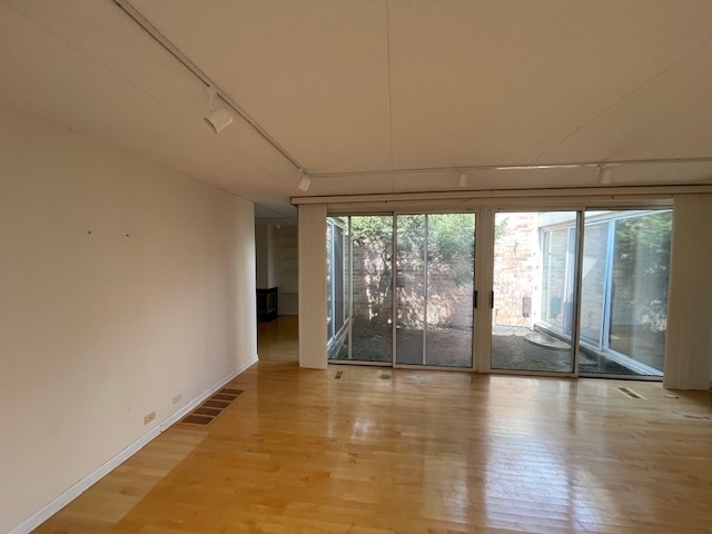 8 Avon Road Northbrook, IL 60062 - Photo 5 of 15 a view of an empty room with wooden floor and a window