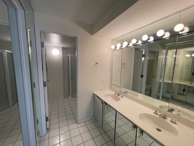 8 Avon Road Northbrook, IL 60062 - Photo 10 of 15 a bathroom with a sink double vanity and a mirror