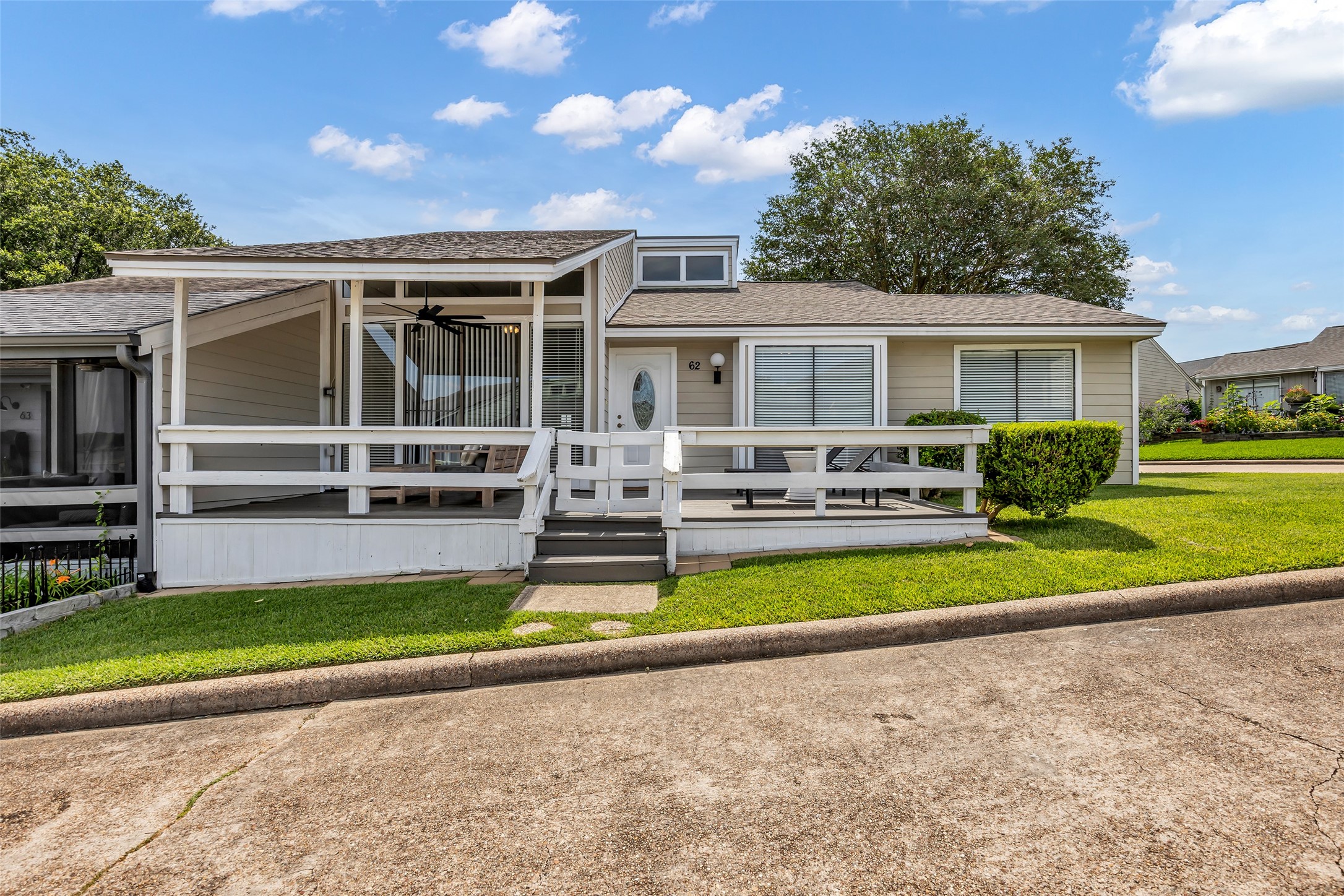 62 April Point Drive North Conroe, TX 77356 - Photo 1 of 25 a view of a house with a swimming pool and a yard