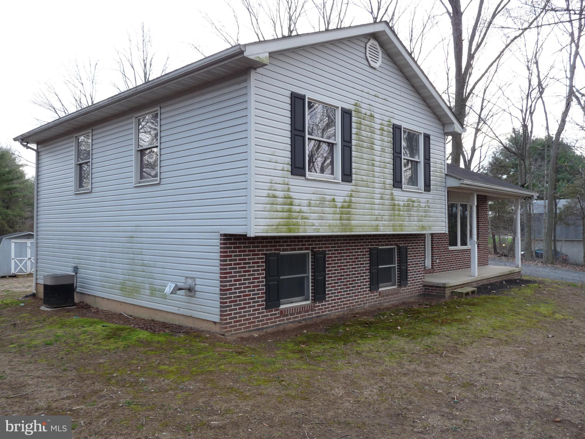 242 West Red Hill Road Conowingo, MD 21918 - Photo 5 of 14 Left Side Exterior - Flue for Pellet Stove