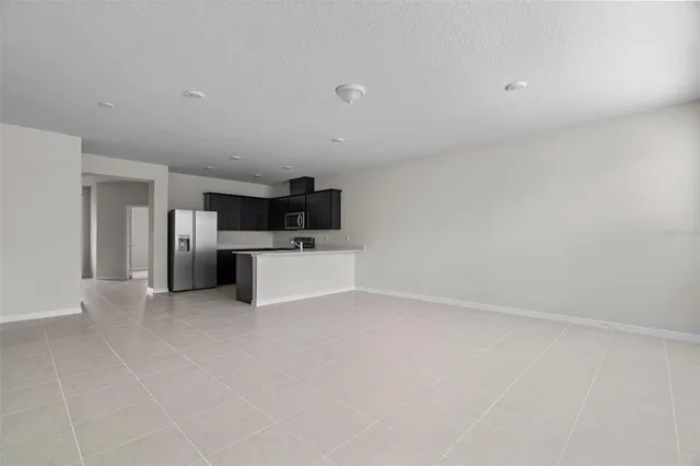 a view of kitchen with cabinets