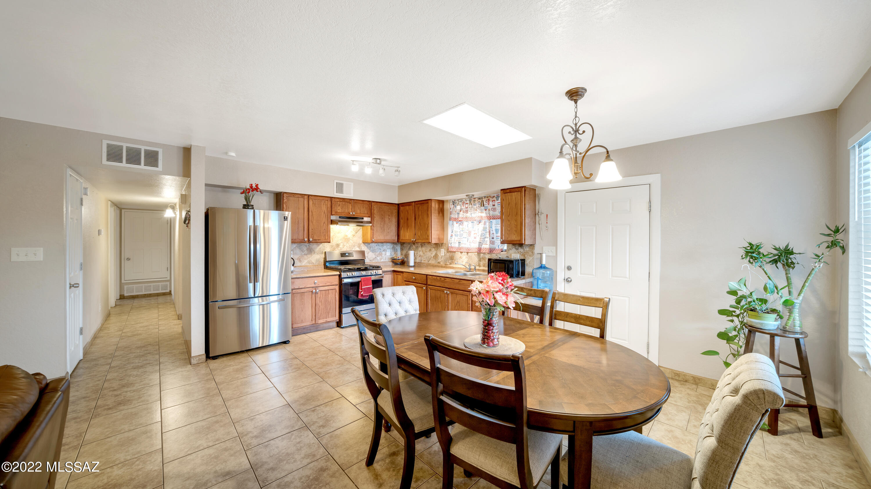 434 Paseo Flamenco Rio Rico, AZ 85648 - Photo 5 of 27 a dining room with furniture and a kitchen view