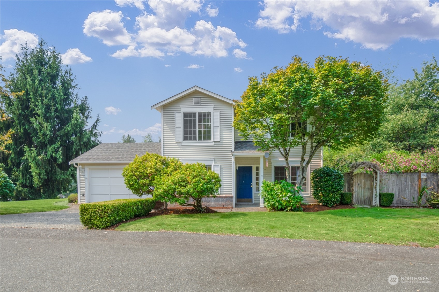 2313 211th Street Southeast Bothell, WA 98021 - Photo 1 of 25 a front view of a house with garden