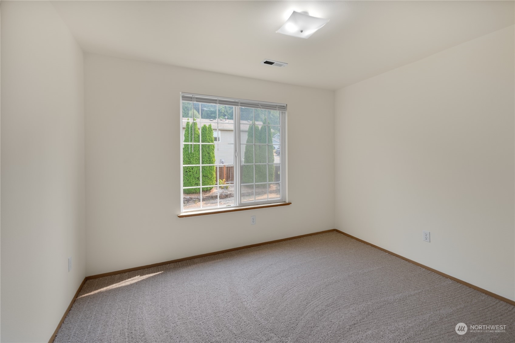 2313 211th Street Southeast Bothell, WA 98021 - Photo 16 of 25 an empty room with a window