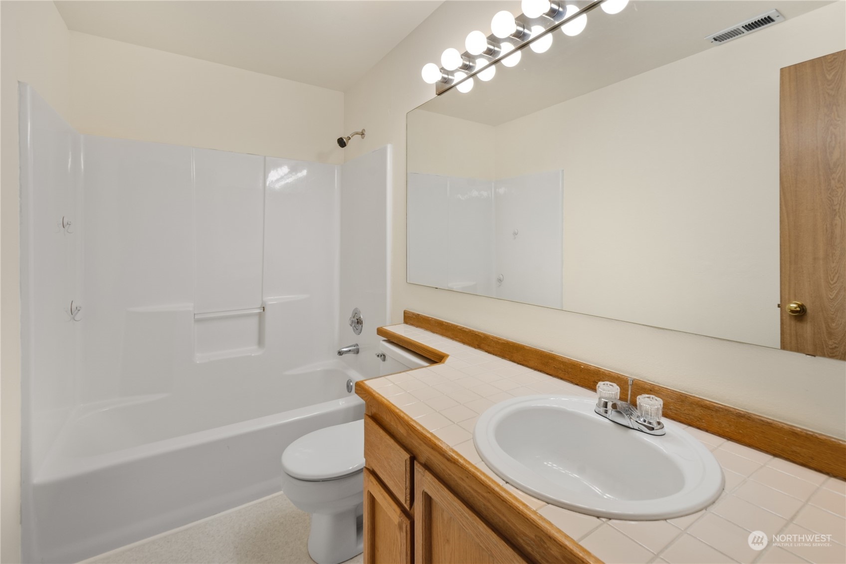 2313 211th Street Southeast Bothell, WA 98021 - Photo 18 of 25 a bathroom with a sink a toilet and shower