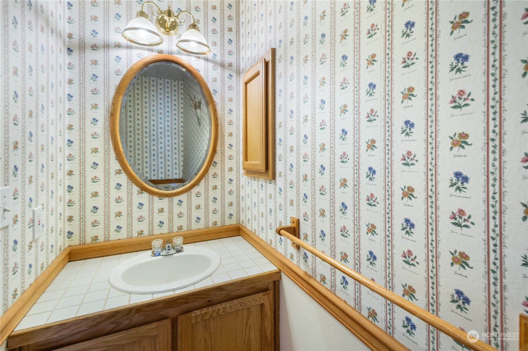 2313 211th Street Southeast Bothell, WA 98021 - Photo 21 of 25 a bathroom with a sink and a mirror