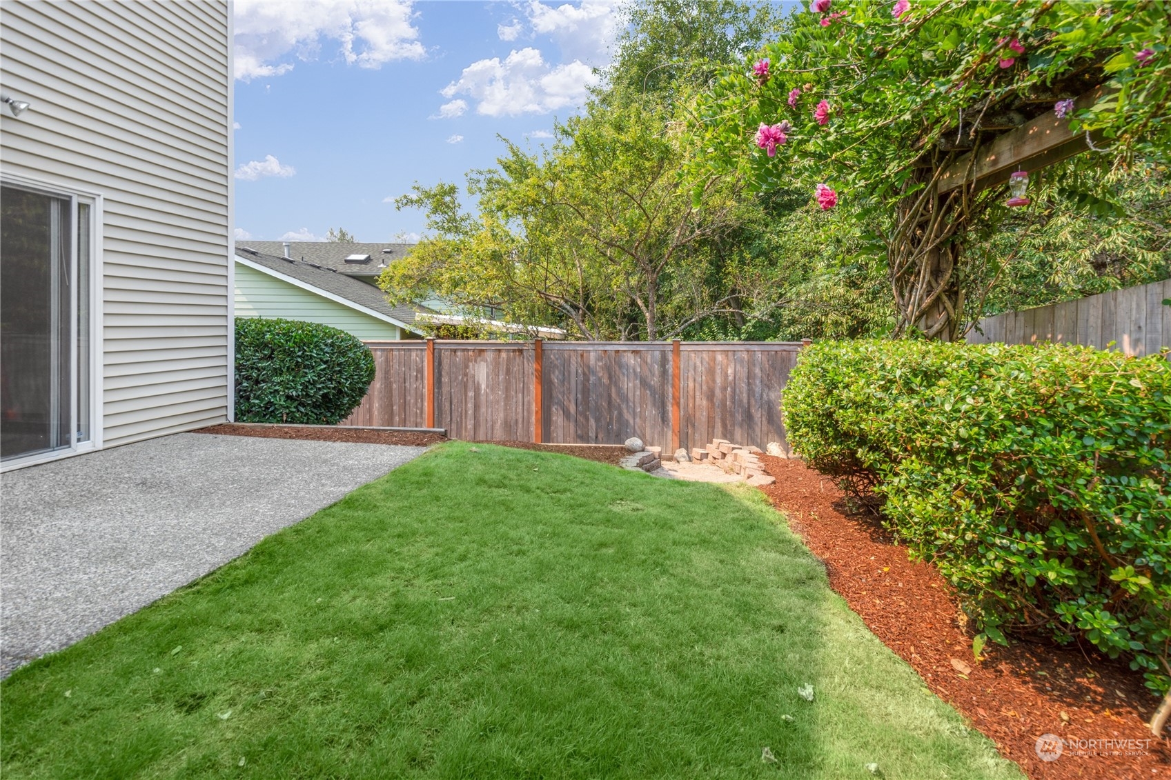 2313 211th Street Southeast Bothell, WA 98021 - Photo 24 of 25 a view of a backyard with wooden fence