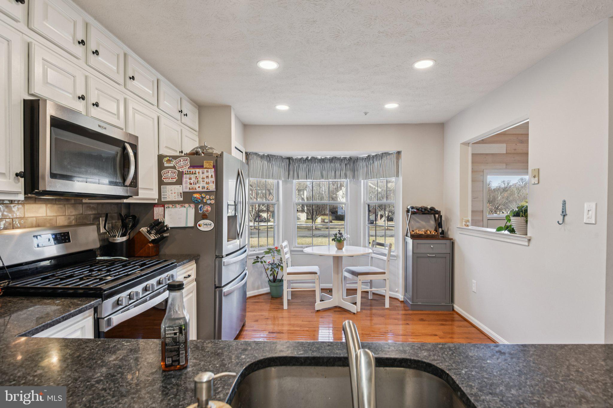 2612 Tallwind Court Crofton, MD 21054 - Photo 11 of 38 a kitchen with stainless steel appliances granite countertop a stove and a sink