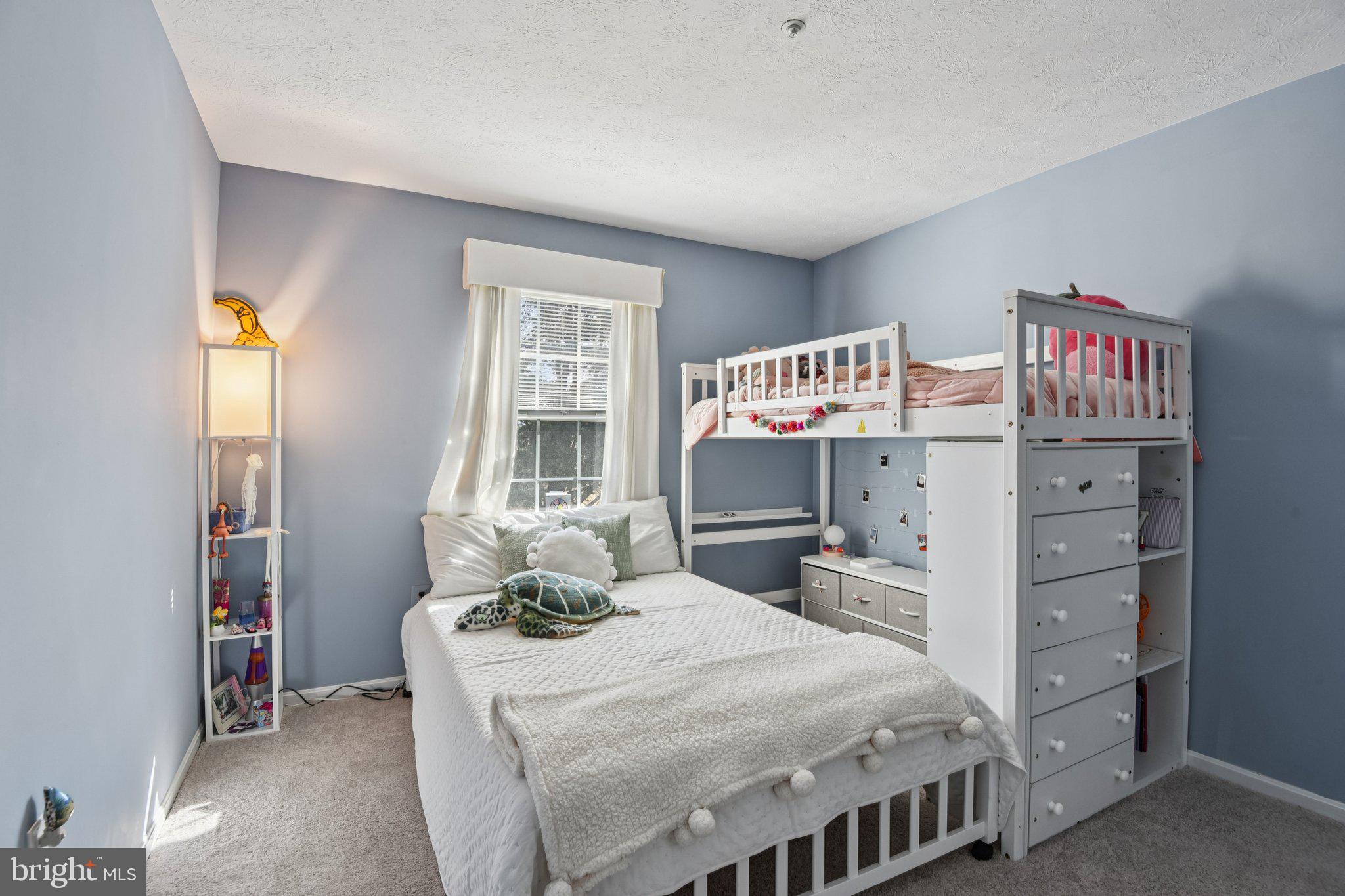 2612 Tallwind Court Crofton, MD 21054 - Photo 19 of 38 a bedroom with a bed and wooden floor